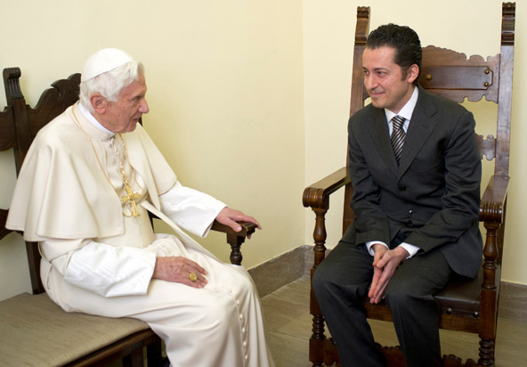 Pope Benedict XVI talks with former papal butler Paolo Gabriele during a private audience at the Vatican Dec. 22. The pope pardoned Gabriele, who was convicted in October of stealing and leaking sensitive documents from the Holy See. After meeting with t he pontiff, Gabriele was freed from prison and returned to his family, the Vatican said. (CNS photo/L'Osservatore Romano via Reuters) 