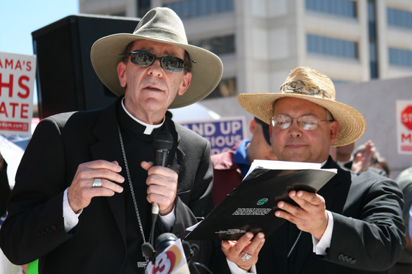 Bishop Thomas J. Olmsted and Auxiliary Bishop Eduardo A. Nevares are pictured here speaking at a March 23, 2012, rally in Phoenix in support of religious freedom. As part of a new five-part plan of prayer and penance, Bishop Olmsted asks for Catholics to participate in next year’s Fornight for Freedom, which would most likely include a similar rally. (J.D. Long-García/CATHOLIC SUN)