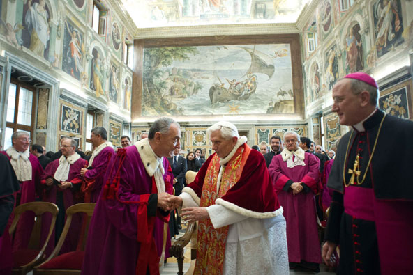 Pope Benedict XVI shakes hands with a member of the Roman Rota to mark the start of the judicial year at the Vatican Jan. 26. The Rota is a Vatican-based tribunal that deals mainly with marriage cases. (CNS photo/L'Osservatore Romano via Reuters)