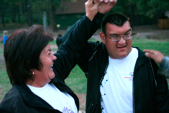 Beatriz and Daniel Quiroz celebrate after Daniel beat his coach in sand volleyball at St. Joseph's Youth Camp 30 miles outside of Flagstaff (J.D. Long-Garcia/CATHOLIC SUN)