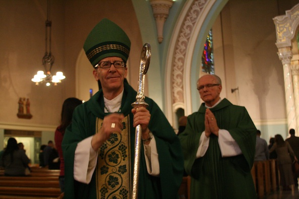 Bishop Thomas J. Olmsted blesses Catholics during the closing procession of the annual Mass for the Unborn at St. Francis Xavier Parish Jan. 20. (Ambria Hammel/CATHOLIC SUN)
