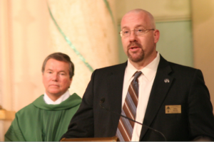 Mike Phelan recaps pro-life efforts and repeatedly thanks local Catholics for their part. (Ambria Hammel/CATHOLIC SUN)