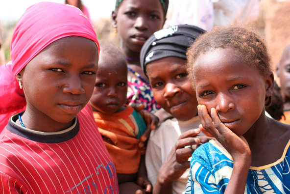 Young girls in West Africa, like these in Niger, drop out of school to help in the household at an early age. On average, girls drop out at an earlier age than boys. They care for younger siblings, grind grain and fetch well water. (J.D. Long-Garcia/CATHOLIC SUN)