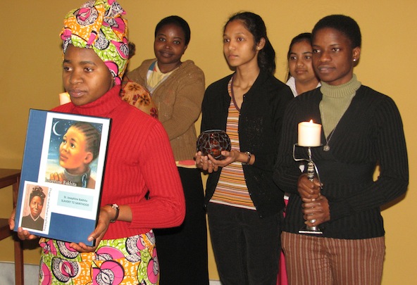 Sisters of the Holy Cross lead the Human Trafficking Awareness Day prayer service, which included the story of St. Josephine Bakhita, at the Church of Our Lady of Loretto in Notre Dame, Ind., Jan. 11. Left to right: Sisters Semerita Mbambu, Rose Kyomukam a, Manorma Kerketta, Jui Clara Corraya and Comfort Arthur. 