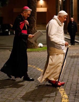 Pope Benedict XVI arrives to attend a meeting with seminarians at the major seminary of the Diocese of Rome Feb. 8. At left is Archbishop Georg Ganswein, prefect of the papal household and the pope's personal secretary. (CNS photo/Tony Gentile, Reuters)
