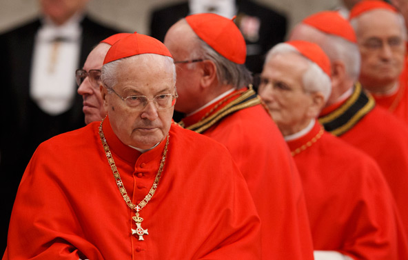 Cardinal Angelo Sodano, dean of the College of Cardinals, left, and other cardinals wait for Pope Benedict XVI's arrival to deliver a talk at the conclusion of a Mass for the Knights of Malta in St. Peter's Basilica at the Vatican Feb. 9. Cardinal Sodano has the responsibility to make preparations for the papal conclave that will be held to elect Pope Benedict XVI's successor. The pope announced his resignation Feb. 11. (CNS photo/Paul Haring)