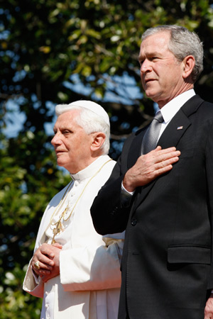 Pope Benedict XVI and U.S. President George W. Bush listen as the U.S. national anthem is played during a ceremony on the South Lawn of the White House in 2008 in Washington. The pope announced Feb. 11 that he will resign at the end of the month. The 85- year-old pontiff said he no longer has the energy to exercise his ministry over the universal church. (CNS photo/CNS photo/Nancy Phelan Wiechec) 