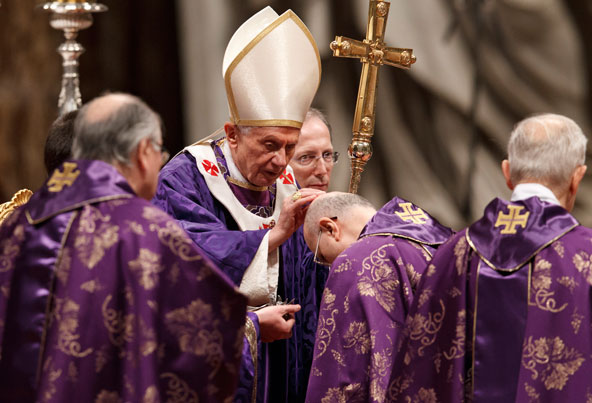 Pope Benedict XVI sprinkles ashes on the head of a cardinal during Ash Wednesday Mass in St. Peter's Basilica at the Vatican Feb. 13. The service was expected to be the last large liturgical event of Pope Benedict's papacy. The pope announced Feb. 11 tha t he will resign at the end of the month. (CNS photo/Paul Haring)