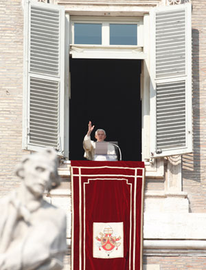 Pope Benedict XVI delivers his blessing as he leads the Angelus from the window of his apartment overlooking St. Peter's Square at the Vatican Feb. 17. (CNS photo/Paul Haring)