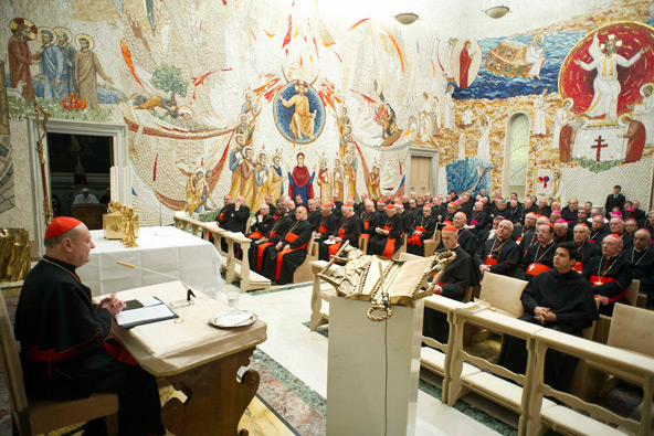 Cardinal Gianfranco Ravasi, president of the Pontifical Council for Culture, addresses members of the Roman Curia during the closing day of a spiritual retreat with Pope Benedict XVI at the Vatican Feb. 23. During the meeting the pope thanked members of the Curia "for these eight years during which you have helped me carry the burden of the Petrine ministry with great competence, affection, love and faith." (CNS photo/L'Osservatore Romano via Reuters)