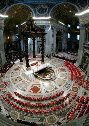 Cardinals sit in a semicircle during the opening Mass of the conclave in St. Peter's Basilica at the Vatican April 18. The cardinals entered a secret conclave inside the Sistine Chapel to elect a new pope. (CNS photo from Reuters)