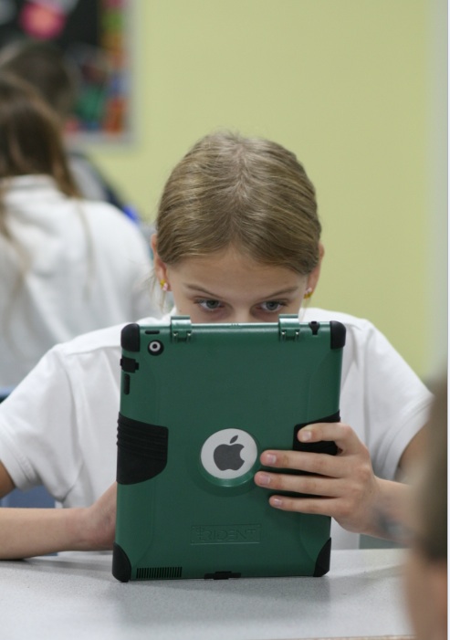 A junior high student at Blessed Pope John XXIII in Scottsdale works on her school-issued iPad. (J.D. Long-García/CATHOLIC SUN)