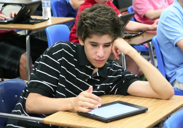 A Brophy freshman uses his iPad during English class. Ninth-graders are the school's first to use iPads throughout the day. (Ambria Hammel/CATHOLIC SUN)