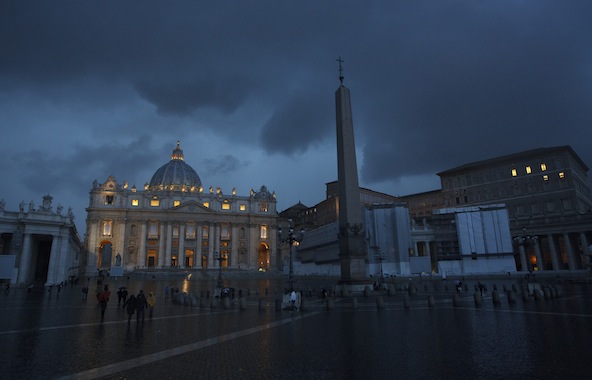 Lightning illuminates the sky over St. Peter's Basilica during a storm in the evening at the Vatican Feb. 11. Earlier in the day Pope Benedict XVI announced that he will resign Feb. 28. The papal apartment is pictured at right. (CNS photo/Paul Haring)