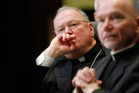 New York Cardinal Timothy M. Dolan listens to proceedings of the U.S. bishops' meeting in November in Baltimore. Cardinal Dolan, president of the U.S. Conference of Catholic Bishops, said in a Feb. 7 statement that the government's new set of proposed ru les on insurance coverage of contraceptives falls short in meeting concerns of the church. (CNS photo/Nancy Phelan Wiechec)