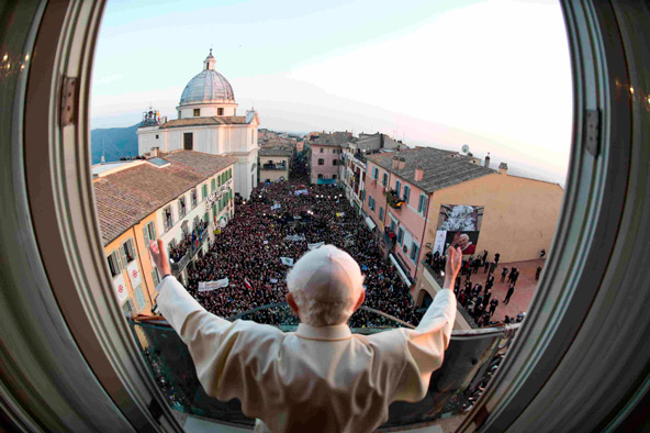 Pope Benedict XVI waves as he appears for the last time as pope at the balcony of his summer residence in Castel Gandolfo, Italy, Feb. 28. It was his final public appearance before his papacy drew to a close. (CNS photo/L'Osservatore Romano via Reuters)