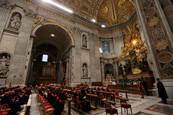 Cardinals attend a prayer service with eucharistic adoration in St. Peter's Basilica at the Vatican March 6. More than 100 cardinals gathered in front of Bernini's statue, "The Chair of St. Peter," for the evening service. (CNS photo/Paul Haring)