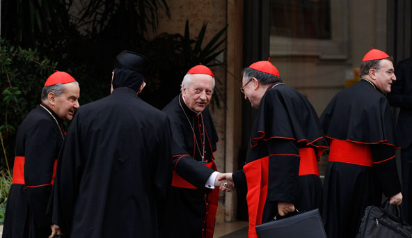 Cardinals Carlo Caffarra of Bologna, Italy, Bechara Rai, Lebanon's Maronite patriarch, Franc Rode, Vinko Puljic of Sarajevo, Bosnia-Herzegovina, and Josip Bozanic of Zagreb, Croatia, talk as they arrive for the final general congregation meeting in the synod hall at the Vatican March 11. (CNS photo/Paul Haring)
