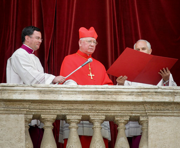 Chilean Cardinal Jorge Medina Estevez appears on the central balcony of St. Peter's Basilica to announce, "Habemus papam" (We have a pope), and the name Joseph Ratzinger, in this April 19, 2005, file photo. That duty will fall to French Cardinal Jean-Lou is Tauran this time around. As senior cardinal deacon, he is honored with the task of announcing the name of the new pope in Latin. (CNS file photo/Nancy Phelan Wiechec)