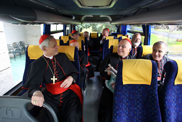 U.S. cardinals take a short bus ride from the Pontifical North American College in Rome to synod hall at the Vatican March 11 for the cardinals' last general congregation meeting before the conclave. Pictured from left, in front, Cardinals Donald W. W uerl of Washington, Francis E. George of Chicago and Daniel N. DiNardo of Galveston-Houston. Behind them, from left, Cardinal Theodore McCarrick, retired archbishop of Washington, and Cardinal Sean P. O'Malley of Boston. In back, from left, Cardinal Roge r M. Mahony, retired archbishop of Los Angeles; Cardinal Justin Rigali, retired archbishop of Philadelphia and Cardinal Timothy M. Dolan of New York. (CNS photo/George Martell, courtesy of The Pilot Media Group)