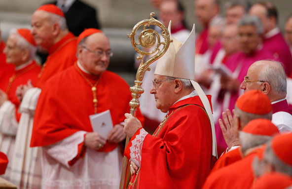 Cardinal Angelo Sodano, dean of the College of Cardinals, arrives to celebrate Mass for the election of the Roman pontiff in St. Peter's Basilica at the Vatican March 12. Concelebrating were some 170 cardinals, including 115 under 80 who were to enter th e conclave in the Sistine Chapel that afternoon. (CNS photo/Paul Haring) 
