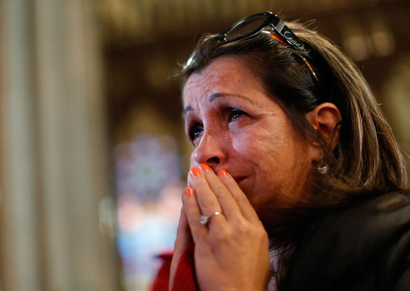 Shelly Guadelupe of Puerto Rico reacts after the announcement of newly elected Pope Francis I at St. Patrick's Cathedral in New York March 13. The world's cardinals meeting in conclave at the Vatican elected Cardinal Jorge Mario Bergoglio of Buenos Aires , Argentina, a 76- year-old Jesuit, as pope. (CNS photo/Brendan McDermid, Reuters)