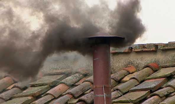 Black smoke billows from the chimney on the Sistine Chapel in this still image taken from video March 13. The black smoke indicated that cardinals did not elect a new pope In the morning voting session of the conclave's second day. (CNS photo/Reuters) 