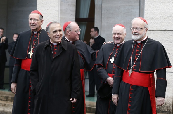U.S. cardinals walk to board a bus from the Pontifical North American College to attend the Mass for the election of the Roman pontiff in St. Peter's Basilica at the Vatican March 12. Pictured from left are Cardinals Roger M. Mahony, retired archbishop of Los Angeles, Daniel N. DiNardo of Galveston-Houston, Timothy M. Dolan of New York, Edwin F. O'Brien, grand master of the Equestrian Order of the Holy Sepulchre, and Sean P. O'Malley of Boston. (CNS/Paul Haring)