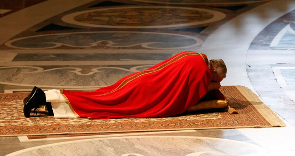 Pope Francis lies prostrate as he arrives to celebrates the Liturgy of the Lord's Passion in St. Peter's Basilica at the Vatican March 29. (CNS photo/Max Rossi, Reuters)
