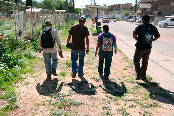 Migrants in Nogales, Mexico, walk down Calle Reforma, past cemeteries, on their way to “El Comedor,” a food outreach run by the Kino Border Initiative. The Jesuit-run effort seeks to faciliate workable migration. (J.D. Long-Garcia/CATHOLIC SUN)