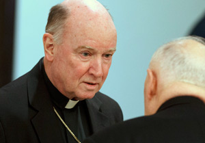 Bishop W. Francis Malooly of Wilmington, Del., talks with Cardinal Theodore E. McCarrick, retired archbishop of Washington, before the start of a Jan. 18, 2012 meeting at the Congregation for Catholic Education during U.S. bishops' "ad limina" visits to the Vatican. (CNS photo/Paul Haring)