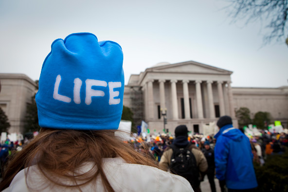 Madeline Bauer of St. Paul, Minn., stands in front of the U.S. Supreme Court building during the March for Life in Washington Jan. 25. Tens of thousands of people marched against abortion for the 40th year since the Supreme Court's Roe v. Wade decision l egalizing abortion in U.S. (CNS photo/Lisa Johnston, St. Louis Review)