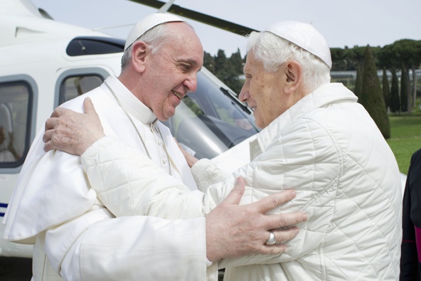 Pope Francis embraces emeritus Pope Benedict XVI at the papal summer residence in Castel Gandolfo, Italy, March 23. Pope Francis travelled by helicopter from the Vatican to Castel Gandolfo for a private meeting with the retired pontiff. (CNS photo/L'Oss ervatore Romano via Reuters)
