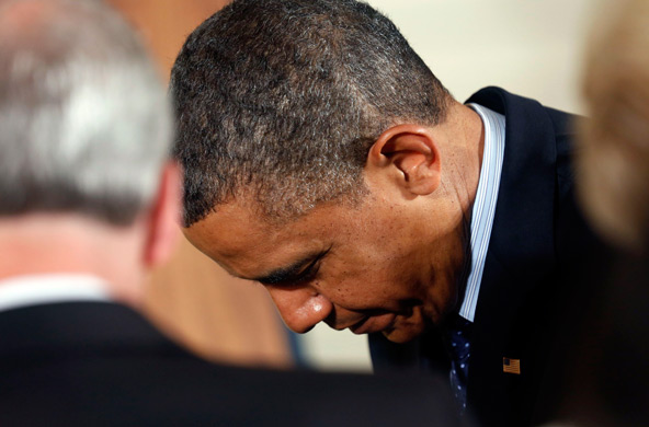 U.S. President Barack Obama bows his head during the Easter Prayer Breakfast at the White House in Washington April 5. (CNS photo/Kevin Lamarque, Reuters)