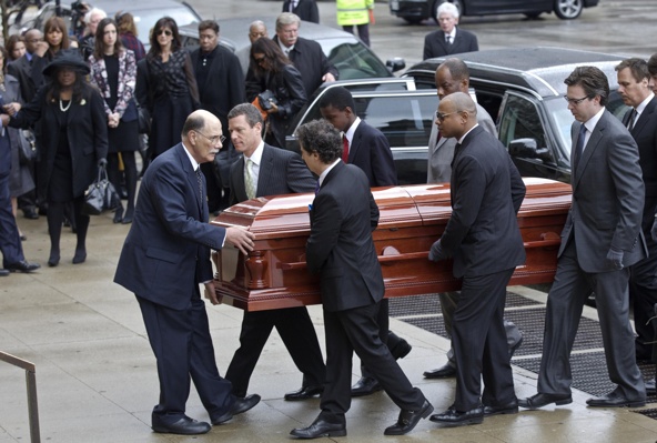 Pallbearers carry the casket of Roger Ebert into Holy Name Cathedral for his funeral Mass in Chicago April 8. The Pulitzer Prize-winning critic died April 4 at age 70 in Chicago. Ebert had been dealing with a series of health struggles since being diagnosed with papillary thyroid cancer in 2002. (CNS photo/John Gress, Reuters)