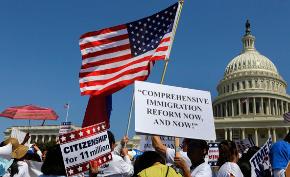 People rally for comprehensive immigration reform April 10 near the U.S. Capitol in Washington. Demonstrators urged lawmakers to support a path to citizenship for an estimated 11 million undocumented immigrants in the U.S. (CNS photo/Larry Downing, Reuters)