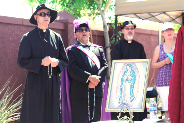 Local priests and the Knights of Columbus joined Bishop Thomas J. Olmsted in praying for the unborn outside a Planned Parenthood on Good Friday.