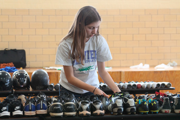 Caitlin White, a junior at Xavier College Preparatory,  believes that all kids can play ball regardless of their family’s ability to afford equipment. (Ambria Hammel/CATHOLIC SUN)