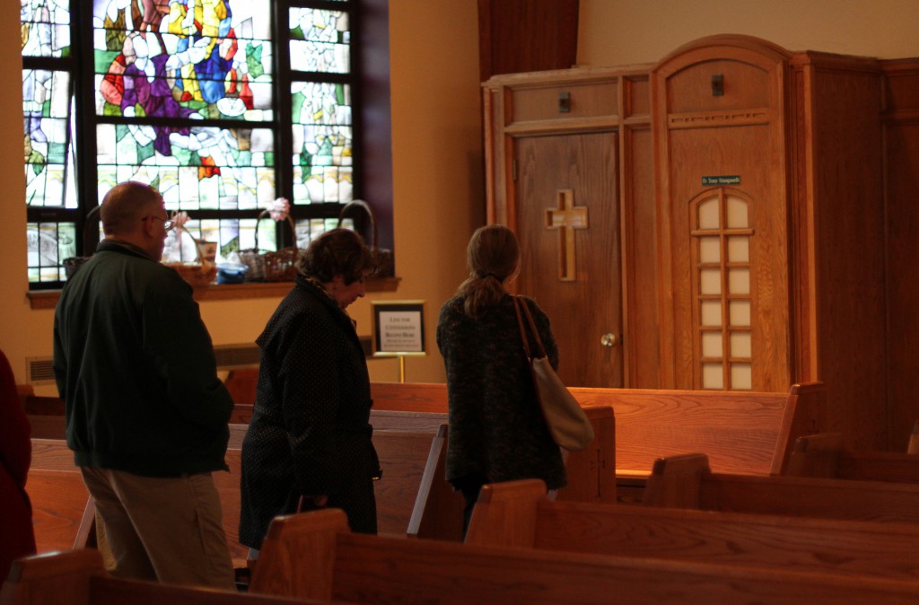 Penitents wait in line to receive the sacrament of reconciliation at Sts. Philip and James Church in St. James, N.Y., March 25. Sts. Philip and James and all other parishes in the Dioceses of Rockville Centre, N.Y, and Brooklyn, N.Y., and the Archdiocese of New York participate annually in Reconciliation Monday, which falls during Holy Week and offers the opportunity for confession from midafternoon into the evening. (CNS file photo/Gregory A. Shemitz)