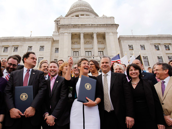 Lawmakers celebrate after the Marriage Equality Act was signed into law at the State House in Providence, R.I., May 2. Rhode Island became the 10th U.S. state to extend marriage rights to same-sex couples. (CNS photo/Jessica Rinaldi, Reuters)