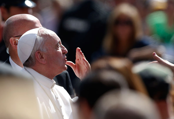 Pope Francis blows a kiss as he arrives to lead his his weekly audience in St. Peter's Square at the Vatican May 8. (CNS photo/Stefano Rellandini, Reuters)
