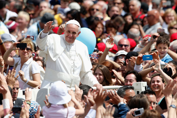 Pope Francis waves at the end of a Mass where he canonized the first Colombian saint, as well as a Mexican nun and some 800 Italians martyred by Ottoman Turks in the 15th century. (CNS photo/Stefano Rellandini, Reuters)