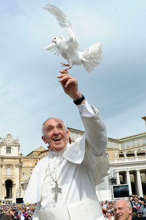 Pope Francis holds a dove before his weekly audience in St. Peter's Square at the Vatican May 15. (CNS photo/L'Osservatore Romano via Reuters) 