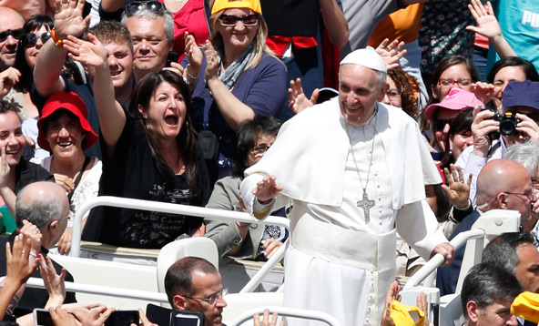 Pope Francis greets the crowd after celebrating Mass on the feast of Pentecost in St. Peter's Square at the Vatican May 19. (CNS photo/Paul Haring)