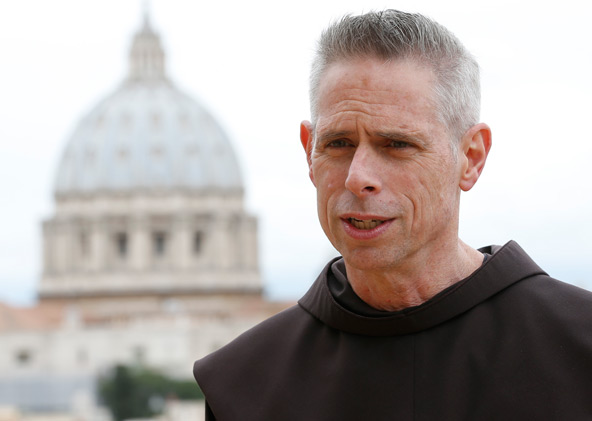 U.S. Franciscan Father Michael Perry, the new minister general of the Order of Friars Minor, is pictured at the order's headquarters in Rome May 23. Father Perry was elected in Rome May 22 by Franciscans representing different parts of the word. The dome of St. Peter's Basilica is seen in the background. (CNS photo/Paul Haring) 
