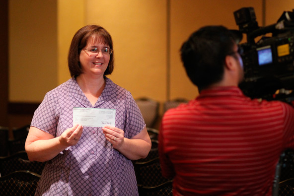 Christine Accurso, executive director of 1st Way Pregnancy Center, addresses local media May 17 after accepting a check from the Knights of Columbus for a new ultrasound unit. (J.D. Long-Garcia/CATHOLIC SUN)