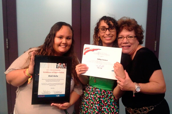 Diali Avila and Melissa Dunmore (left and center) with Catholic Charities EmpowerU proudly display their certificates presented by Linda Jackson, senior tax consultant with the IRS (right). The certificates were awarded for their outstanding efforts in coordinating this year’s Volunteer Income Tax Assistance program.