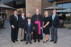 Auxiliary Bishop Eduardo A. Nevares and Bishop Thomas J. Olmsted pose for a photo with supporters of the Catholic Community Foundation. 