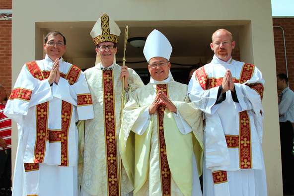 Deacon Scott Sperry, Bishop Thomas J. Olmsted, Auxiliary Bishop Eduardo A. Nevares and Deacon Keith Kenney pose for a photo after the May 26 ordination. (Ambria Hammel/CATHOLIC SUN)