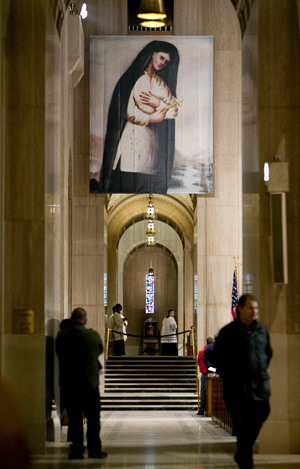 An image of St. Kateri Tekakwitha hangs in the Basilica of the National Shrine of the Immaculate Conception in Washington Jan. 26 during the national Mass of thanksgiving for the canonization of St. Kateri and St. Marianne Cope. (CNS photo/Nancy Phelan Wiechec)